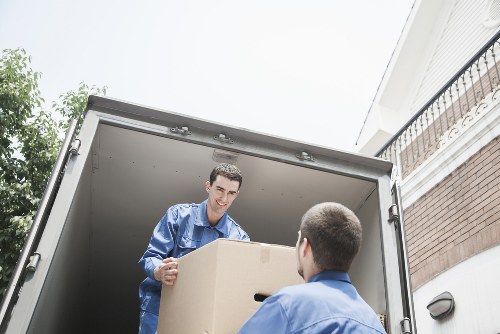 A moving team reviewing risks before continuing a removal task