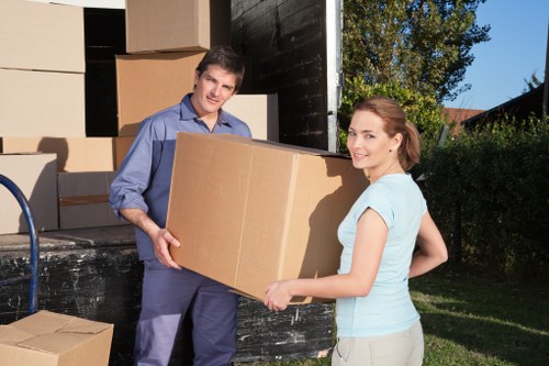 Professional removals team handling boxes for a flat move in Pimlico